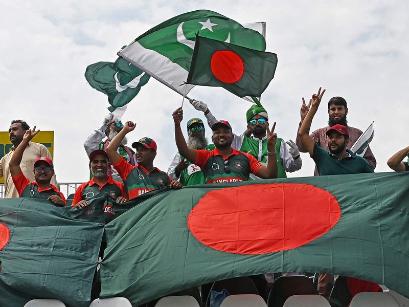 Bangladesh and Pakistan fans wave their national flags