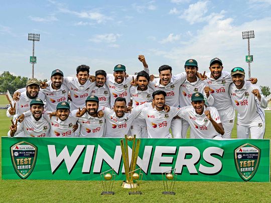 Bangladesh's players celebrate with trophy 