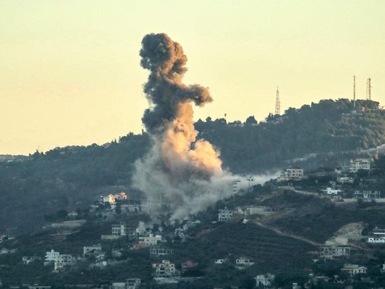 Smoke billows from the site of an Israeli strike