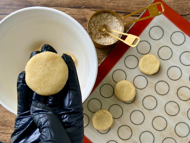 Now, take a small portion of the cookie dough and roll it out into a ball. 