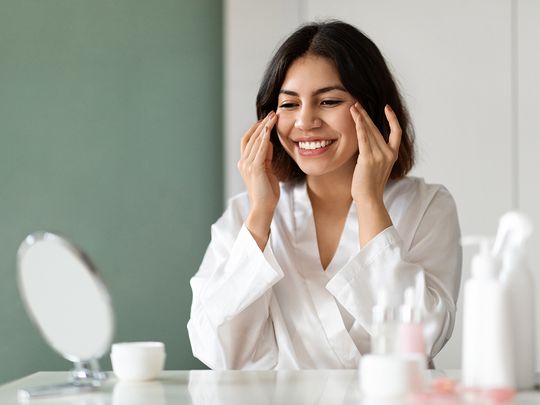 Woman putting eye creams