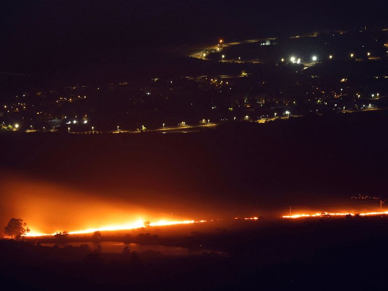 Fires burn as a result of rockets launched from Lebanon into northern Israel