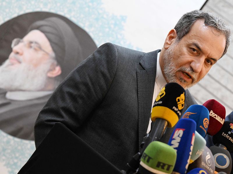 Iranian Foreign Minister Abbas Araghchi speaks to the press