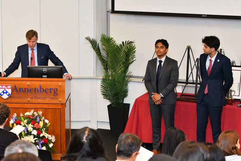 Larry Jameson, the President of the University of Pennsylvania (left), awarding Rahul Nambiar (centre) and Yash Dhir with the funding. 