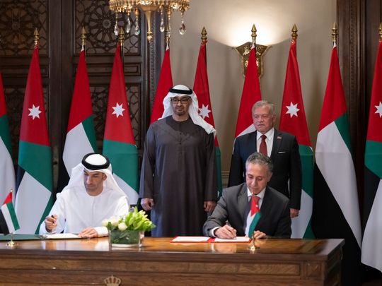 Sheikh Mohamed bin Zayed Al Nahyan, President of the United Arab Emirates, and King Abdullah II, King of Jordan, witness the signing of a UAE-Jordan Comprehensive Economic Partnership Agreement (CEPA), during a reception at Basman Palace. Seen signing is Dr Thani bin Ahmed Al Zeyoudi, UAE Minister of State for Foreign Trade, and Yarub Qudah, Minister of Industry, Trade and Supply of Jordan. 