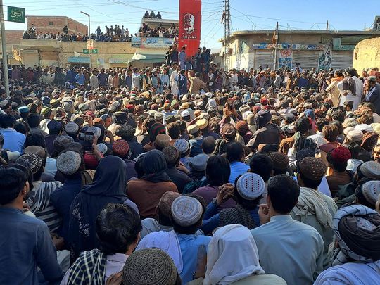 Labourers gather to protest against the killings of coal miners