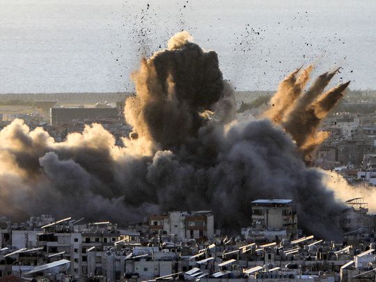 A cloud of smoke erupts following an Israeli airstrike on Beirut's southern suburbs