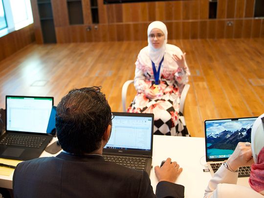 A participant answering judges of the Arab Reading Challenge