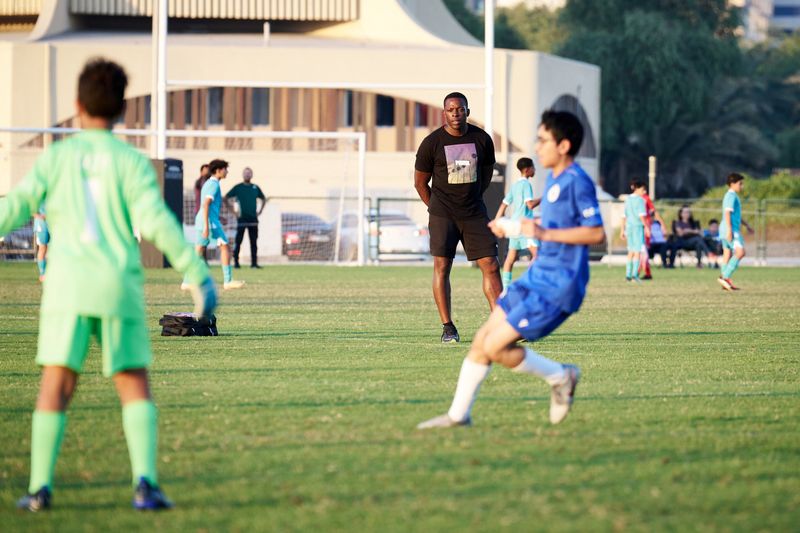 Nedum Onuoha watches a Man City Abu Dhabi League match