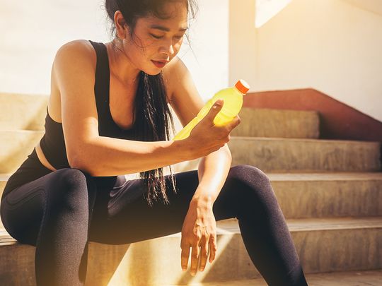 Woman drinking electrolytes