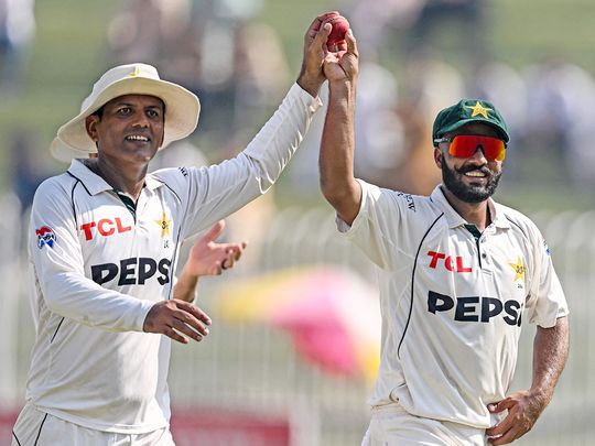 Pakistan's Sajid Khan (R) and Noman Ali celebrate 