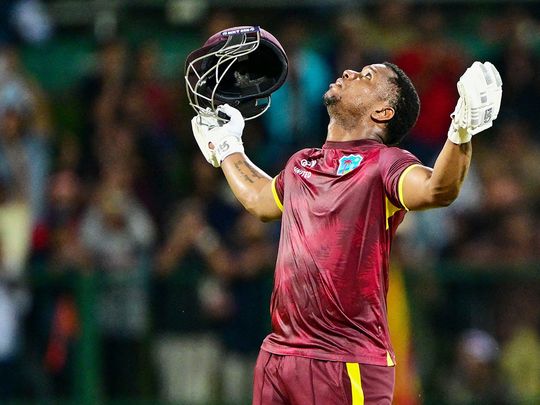 West Indies' Evin Lewis looks to the sky as he celebrates 