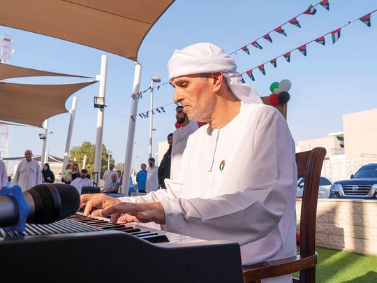 Khaled-Moustafa-plays-piano-during-an-event-at-Amana-Healthcare