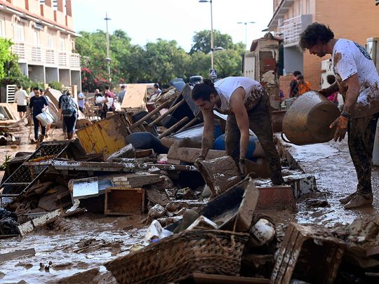 Spain flood deaths top 200, more troops join rescue