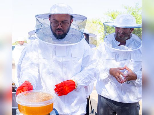 (L) Dr Khalifa Musabah Al Tunaiji, head of Sharjah Agriculture and Livestock Department and CEO of Ektifa, with the first batch of honey from the reserve