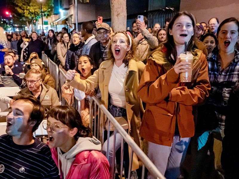 Attendees watch as results are broadcast 