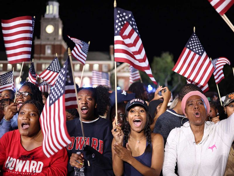 Supporters wave US flags