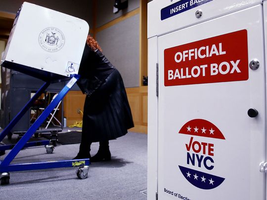 Voters fill out their ballots at a polling station in New York City on Election Day, November 5, 2024. 