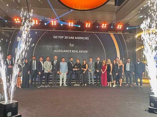 Team Allegiance Real Estate holding the Top Damac Broker Award Q3 2024