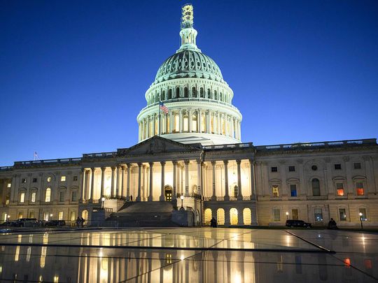 The US Capitol is seen at dusk in Washington.