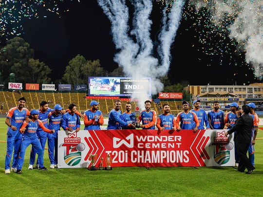 India players hold the trophy as they celebrate