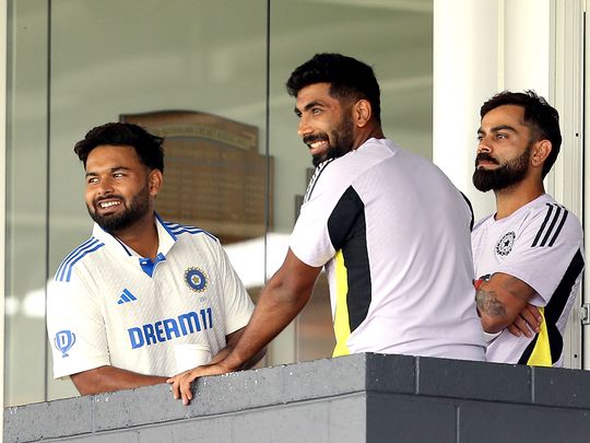 Indian players Virat Kohli (R), Rishabah Pant (L) and Jasprit Bumrah look on