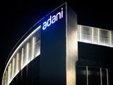 The Adani Group headquarters at night in Ahmedabad