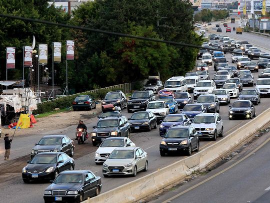 People drive on the highway between Sidon and Tyre 