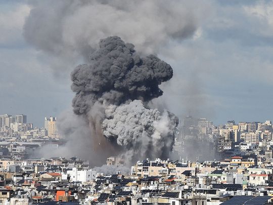 Smoke billows above Beirut’s southern suburbs following an Israeli airstrike 