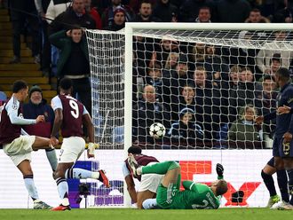 Aston Villa's midfielder Morgan Rogers (L) scores, but the goal is disallowed