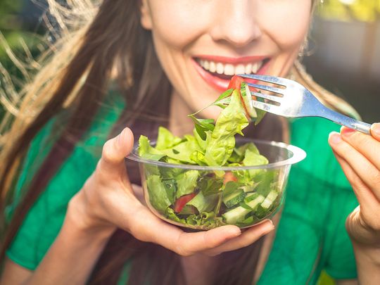 woman eating vegetables