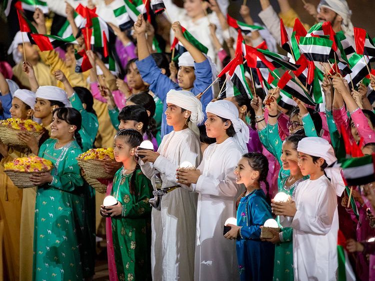 Performers participate in the 53rd Eid Al Etihad official show، at the base of Jebel Hafeet. 