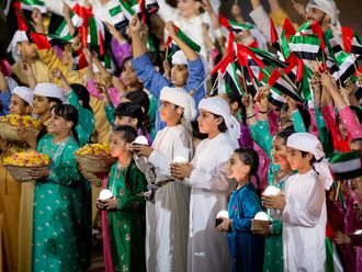 Performers participate in the 53rd Eid Al Etihad official show، at the base of Jebel Hafeet. 