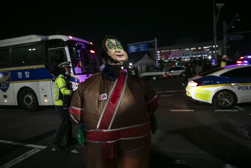 A protester against South Korean President Yoon Suk Yeol outside the National Assembly