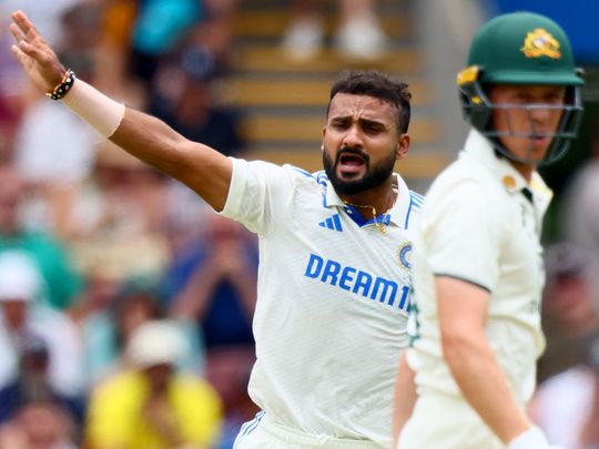 India's paceman Akash Deep reacts after a delivery to Australia's Nathan McSweeney