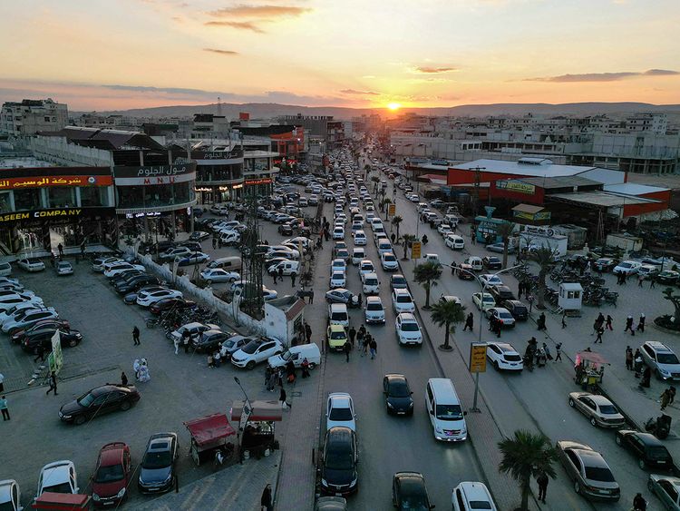 This aerial picture shows traffic moving in the town of Al Dana, near Sarmada, in the northern Syrian province of Idlib. 