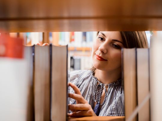 Person at bookshelves